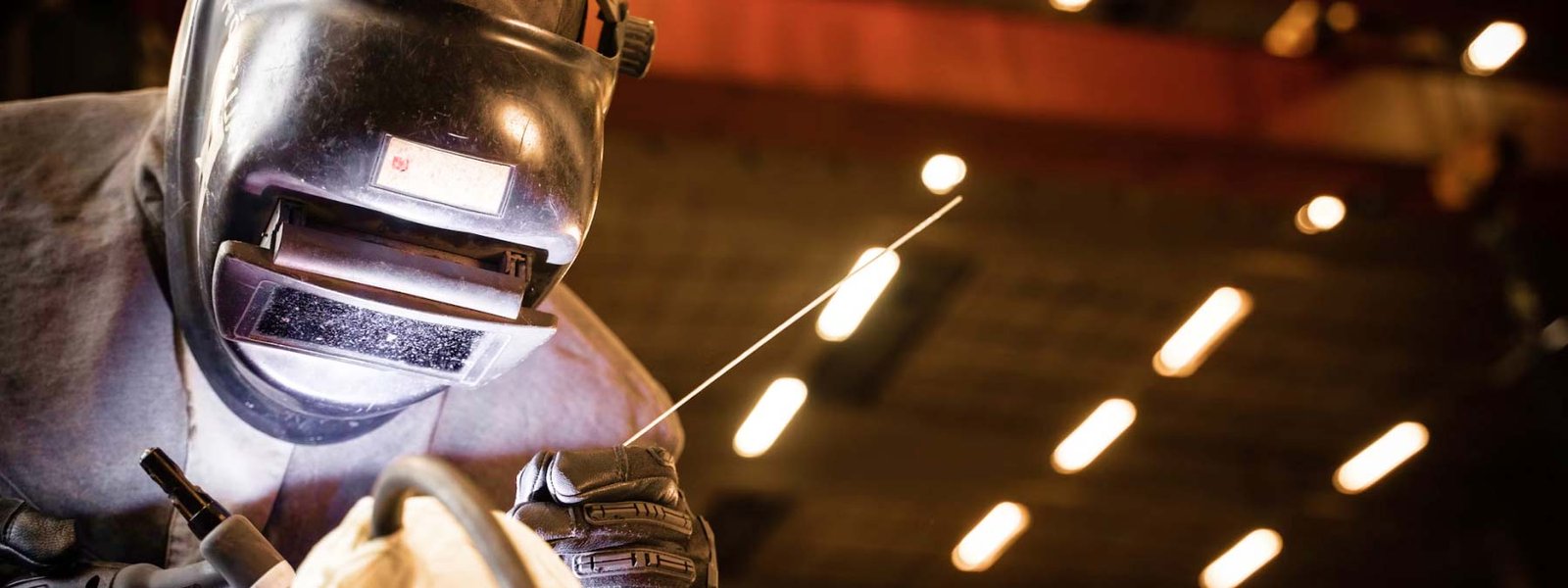 Man Wearing Welding Helmet Man Wearing Welding Helmet
